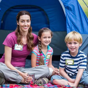 Family camping scene showing kids wearing cute cartoon hand-written name label stickers
