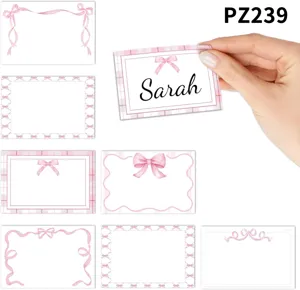Detail of various pink bow design self-adhesive name labels for school supplies