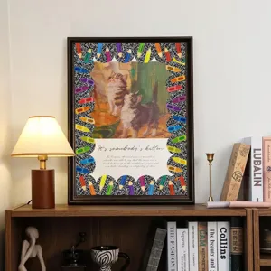 Colorful pencil border sticker roll used for decorating a framed cat poster on a shelf