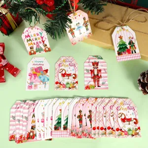Detailed view of pink Christmas gift tags featuring Nutcracker and ballet soldier designs.