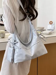 Bolso hobo de cuero suave azul claro con lazo lateral y estuche extra
