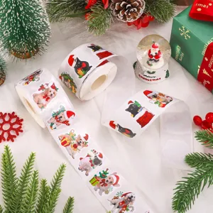 Close-up of Christmas stickers roll featuring festive cats and dogs in Santa hats.