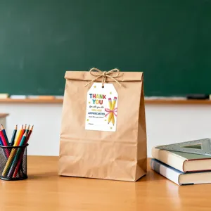 Teacher appreciation gift tag with Thank You message on a brown gift bag