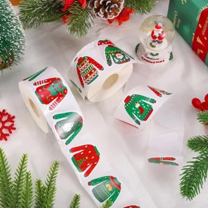 Detailed view of ugly Christmas sweater stickers roll with festive holiday patterns