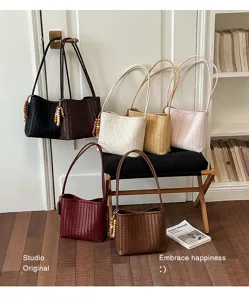 Selection of woven faux leather shoulder bags in various chic colors for women