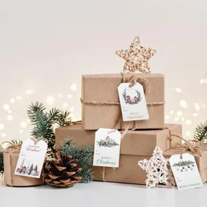 Detailed view of Christmas tags with gnome and cottage designs on brown gift boxes
