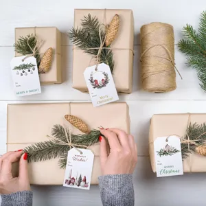 Set of 48 Christmas gift tags with house and gnome designs on wrapped gifts.