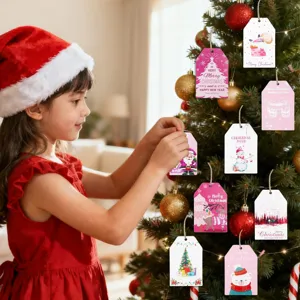 Girl hanging colorful Christmas gift tags with Santa and reindeer on a tree.
