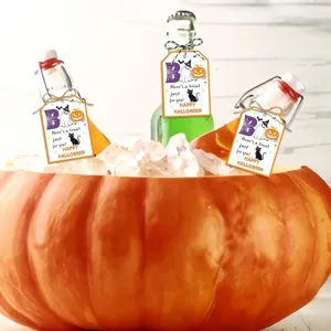 Cute Halloween bottle gift tags with ghost and pumpkin designs in a festive ice bucket