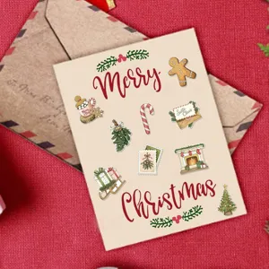 Close-up of vintage watercolor Christmas stickers featuring gingerbread and festive motifs