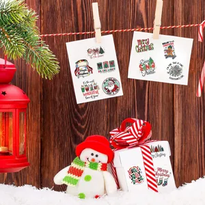 Vintage watercolor Christmas stickers applied to a gift box in a festive wooden scene
