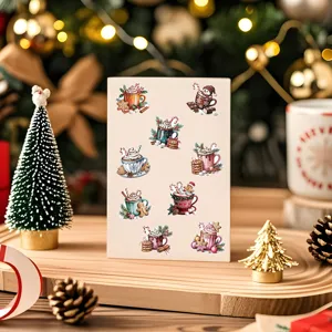 Close-up of vintage watercolor Christmas stickers on a card in a cozy festive setting