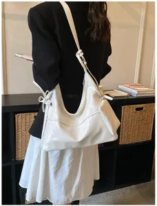 Stylish white soft leather hobo bag for women featuring a small detachable pouch accessory