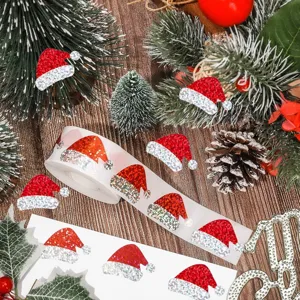 Vista detallada de pegatinas láser rojas con forma de gorro de Papá Noel sobre fondo festivo