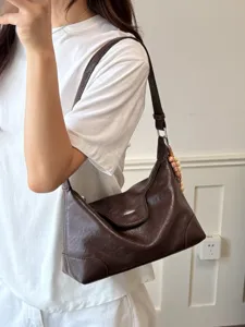Minimalistische koreanische dunkelbraune Schultertasche aus weichem Leder mit Nähten