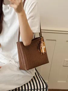 Elegant French style brown woven shoulder bag for women with wooden beaded charm