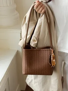 Elegant French style brown woven leather shoulder bag with beaded charm for daily commuting