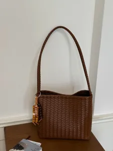 Minimalist French style brown woven shoulder bag for women, perfect for daily commuting