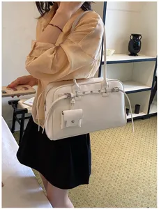 Elegant white soft leather shoulder bag with metal buckle detail and small pouch