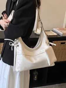 Elegant white soft leather commuter hobo bag for women with a small pouch attachment