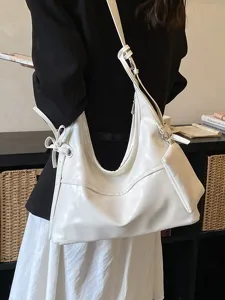 Minimalist white soft leather shoulder bag with matching pouch for commuter style