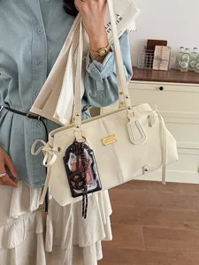 Retro cremefarbene Schultertasche für Damen im Pendler-Stil mit schickem Schleifendetail