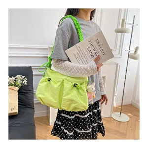 Modern neon green utility tote bag featuring drawstring pockets and ruffled strap
