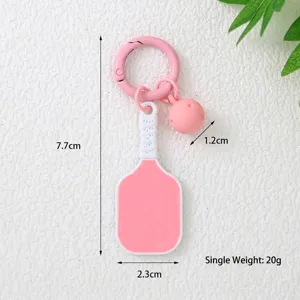 Dimensions détaillées du porte-clés raquette de pickleball rose avec breloque balle
