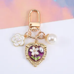 Elegant vintage heart keychain with pearl and camellia flower charms for bag decoration