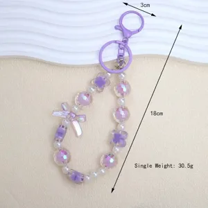 Detailed view of purple bow beaded keychain with dimensions 18cm and weight 30.5g