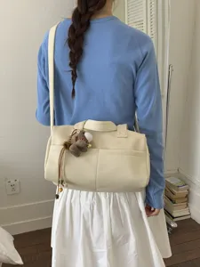 Elegant cream lychee grain leather tote bag for women with a cute horse charm