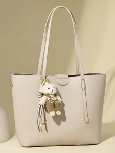 Minimalist beige commuter tote bag for women with cute teddy bear charm