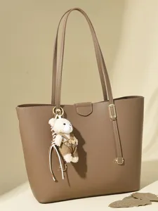 Minimalist brown large capacity tote bag with cute bear keychain accessory