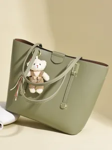 Large capacity olive green faux leather tote bag for women featuring a cute teddy bear charm