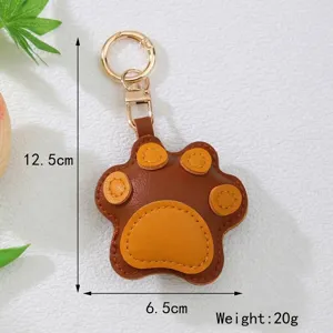 Detail view of cute leather cat paw keychain showing 12.5cm height and 6.5cm width dimensions