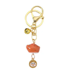 Handcrafted Chinese zodiac ceramic pig keychain with golden bell and ring charm for bags
