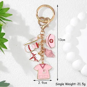 Detailed macro view of a medical themed pink keychain featuring nurse hat and syringe charms
