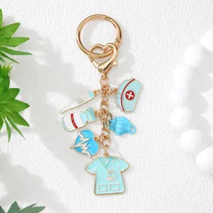 Detailed view of nurse themed keychain with medical charms on a white background