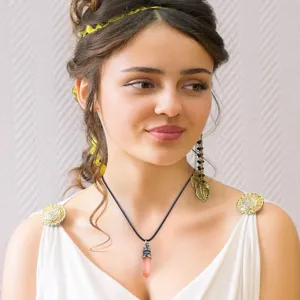 Model wearing a pink crystal hexagon pendant necklace with durable black wax cord detail