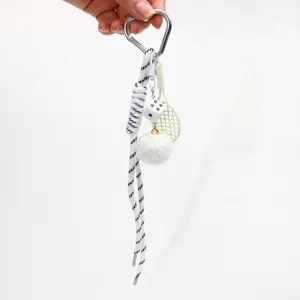 Fashionable keychain featuring heart carabiner, white pom-pom, and mini tennis racket