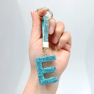 Luxury light blue rhinestone initial E keychain with sparkling crystal strap for bags