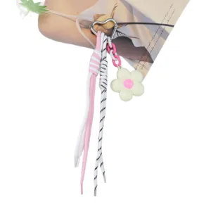 Floral keychain with braided ropes and heart-shaped metal clip for bags