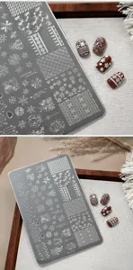 Close-up detail of TG-007 Christmas nail stamping plate with snowflake and knit patterns