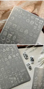 Macro detail of comic graffiti nail art stamping plate with street style characters