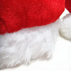 Macro detail showing soft white long plush trim and sparkly red velvet Christmas hat fabric