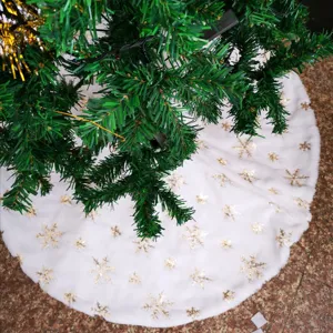 White faux fur Christmas tree skirt featuring golden snowflake sequin embroidery details