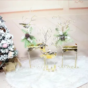 Festive set of three gold sequin reindeer Christmas decorations placed on a white plush rug