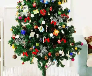 Close-up of a decorated Christmas tree with colorful ornaments and white snowflakes