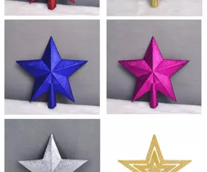 Detailed view of colorful glitter Christmas tree topper stars in blue, pink, and silver