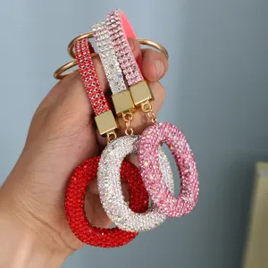 Luxury rhinestone letter O keychain accessory in red white and pink colors for bags